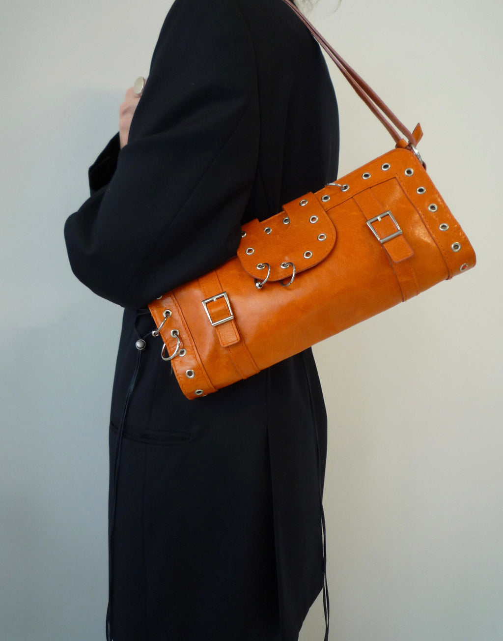 020 Orange leather piercing bag